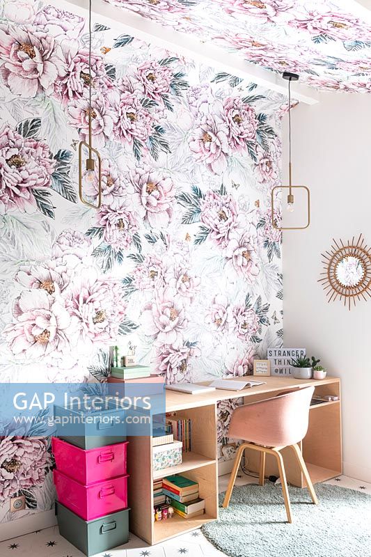 Floral wall paper on feature wall and ceiling around desk