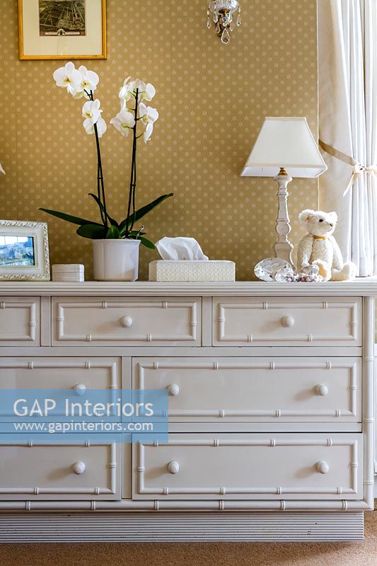 White chest of drawers in classic style bedroom 