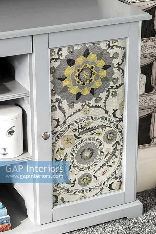 Fabric door inlay in modern cabinet 