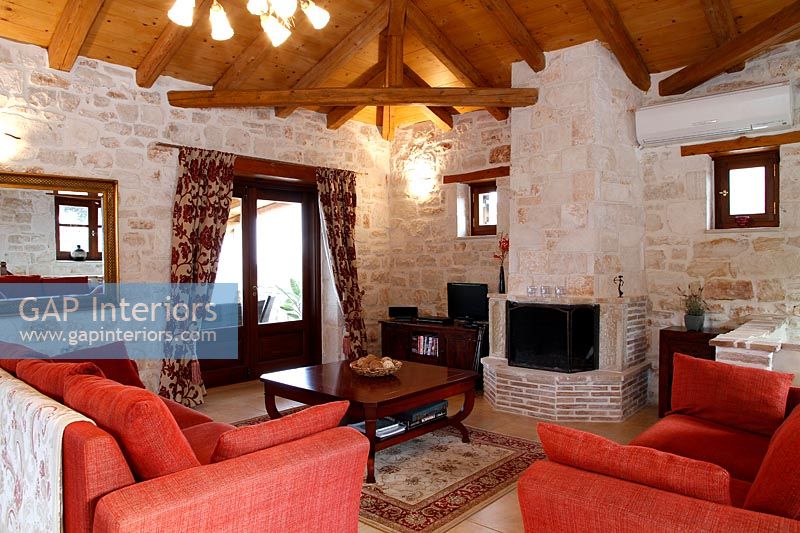 Vaulted ceiling in stone country living room 