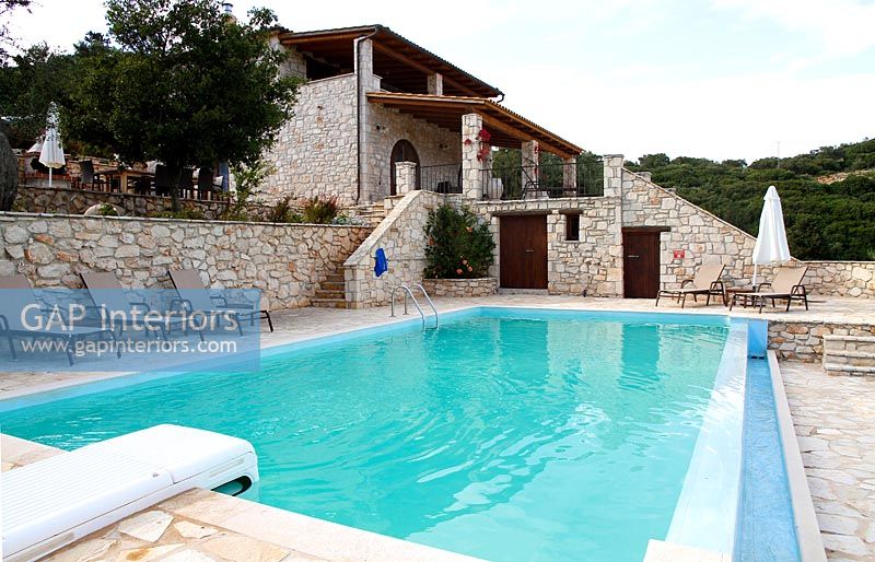 Swimming pool and stone house 