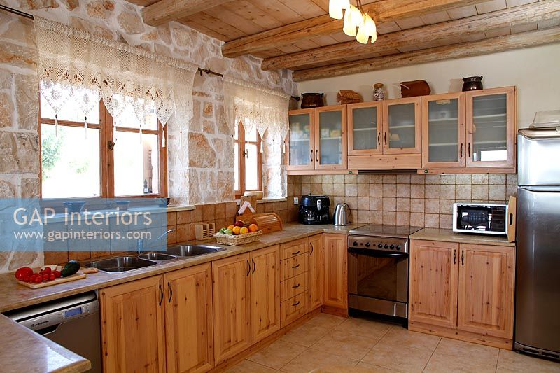 Exposed stone wall in country kitchen