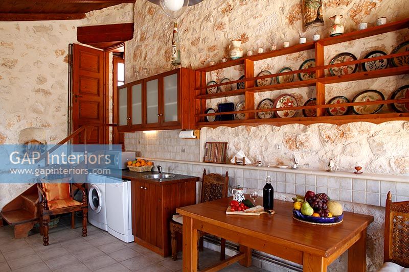 Country kitchen with exposed stone walls 