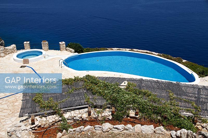 Overview of swimming pool with sea views 