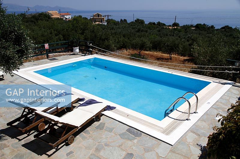 Overview of swimming pool with coastal views 