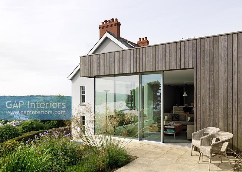 Exterior of contemporary extension to country house with scenic views 