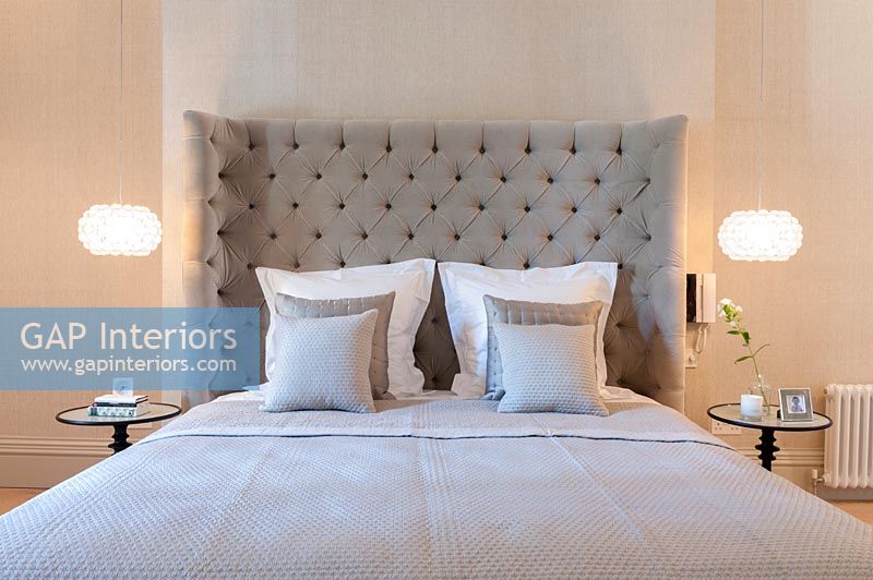 Modern classic style bedroom with large headboard 