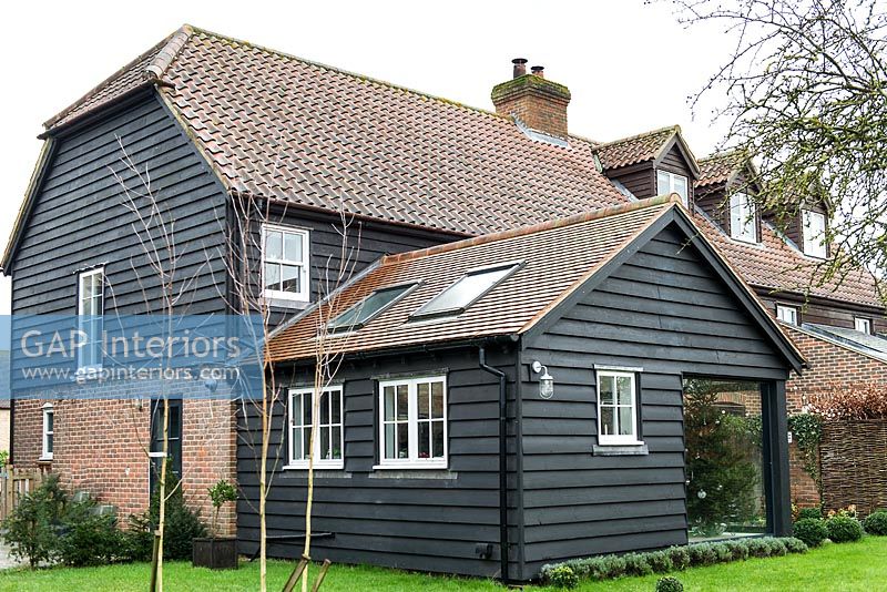 Exterior of black wooden country house 