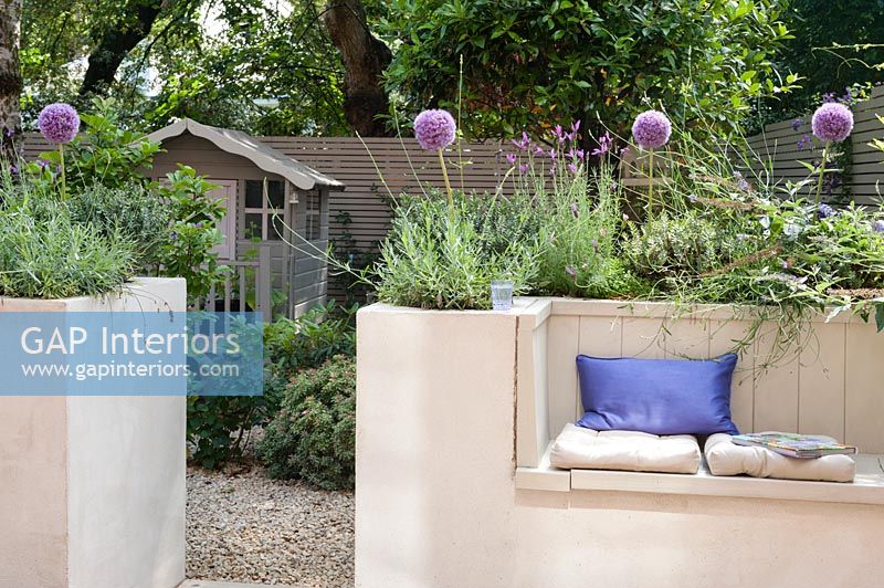 Built-in bench seating in contemporary courtyard garden
