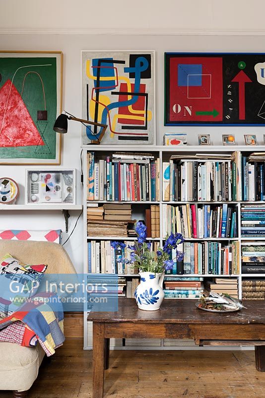 Bookshelves in colourful modern living room