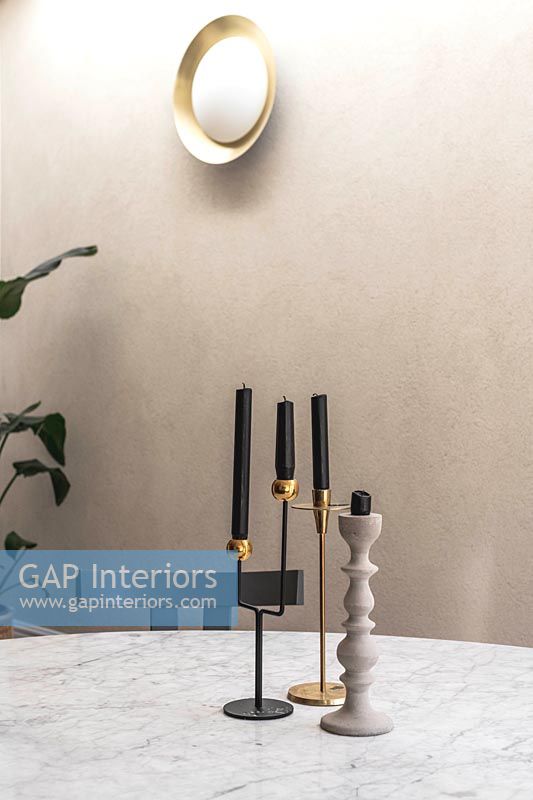 Candlesticks on marble dining table 