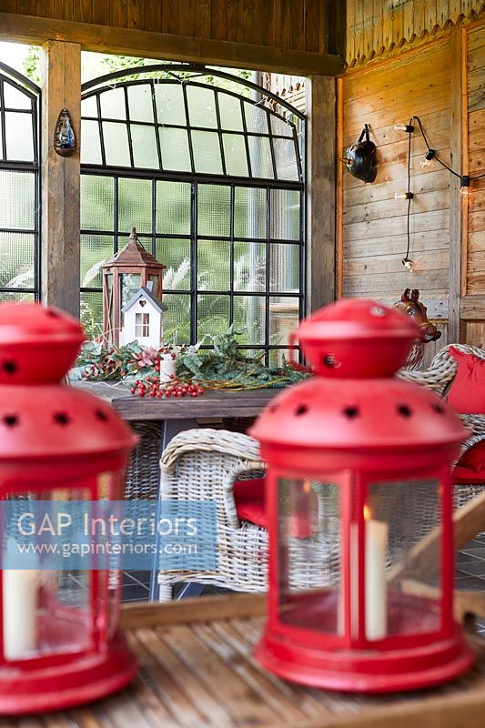 Red lanterns in Country dining room decorated for Christmas 