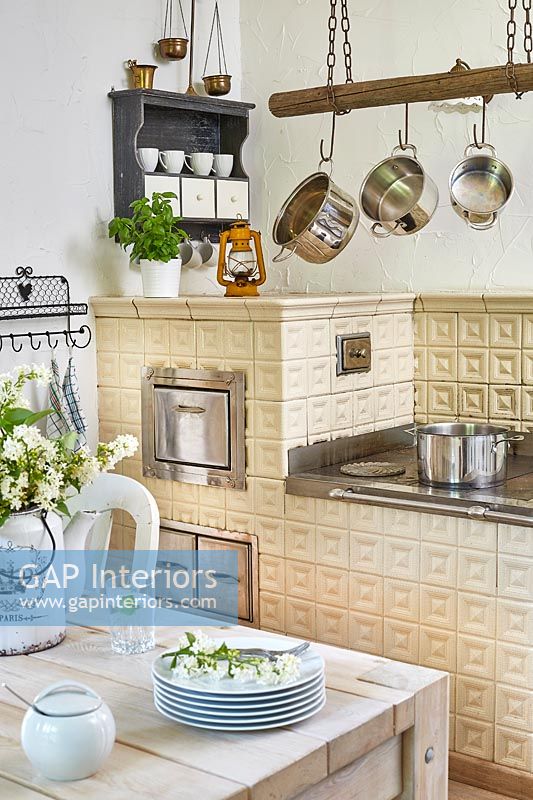 Country kitchen with traditional tiled oven