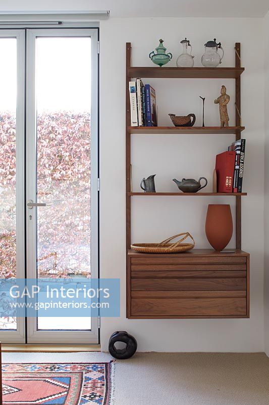 French windows and wall mounted shelf unit 