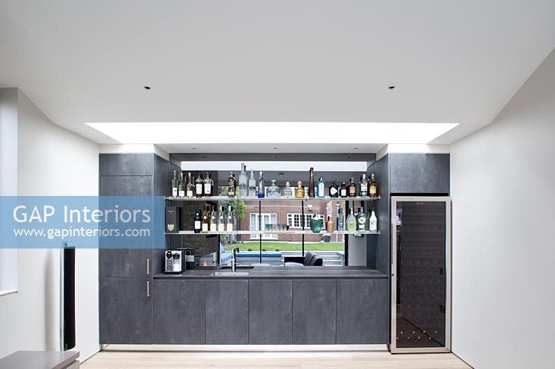 Bar at one end of contemporary living room 