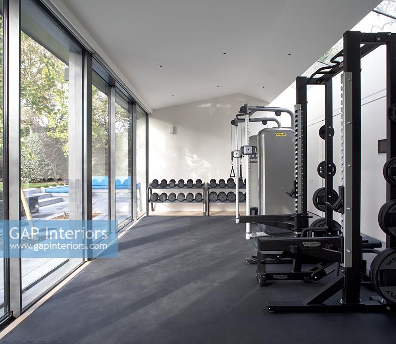 Indoor gymnasium with weights exercise machines 