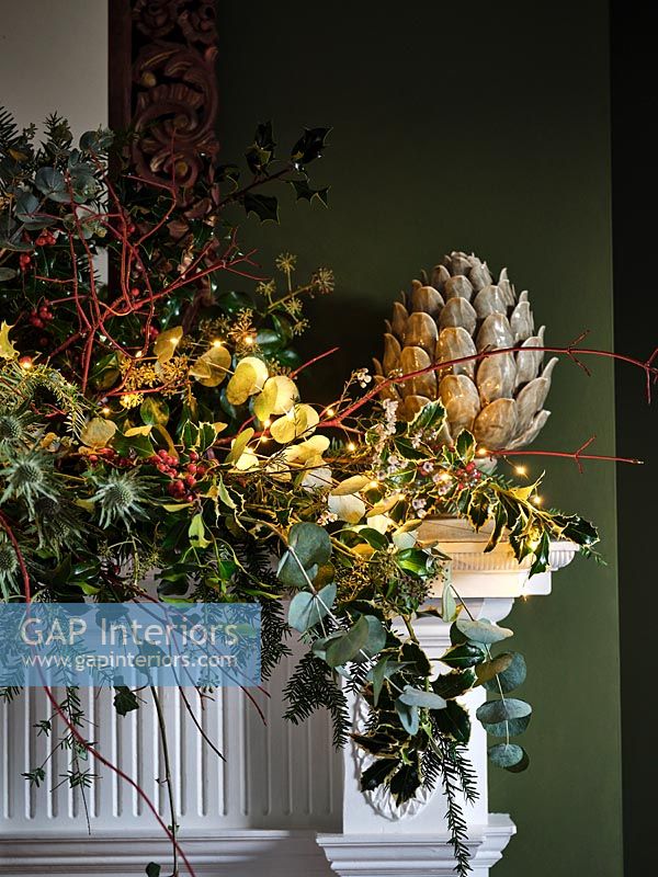 Detail of garland on mantelpiece at Christmas time 