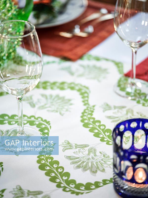 Detail of patterned tablecloth on dining room table 