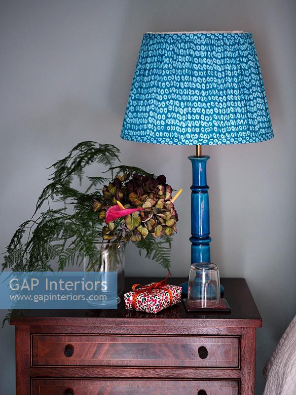 Blue lamp on sidetable