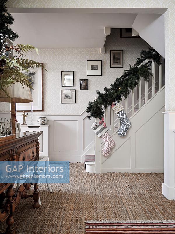 Stairs with Christmas garland and stockings