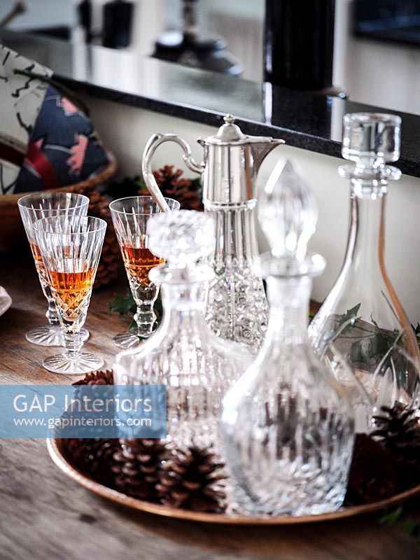 Glass decanters on sideboard