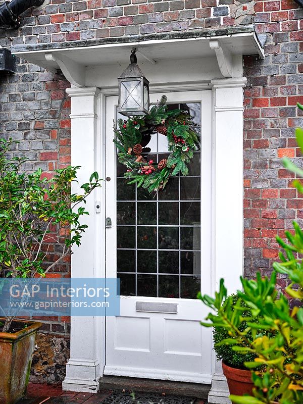 Country house door with Christmas wreath