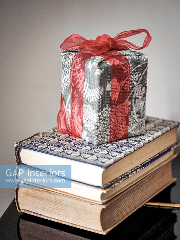 Christmas gift on stack of books 