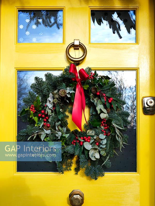 Country house door decorated for Christmas 
