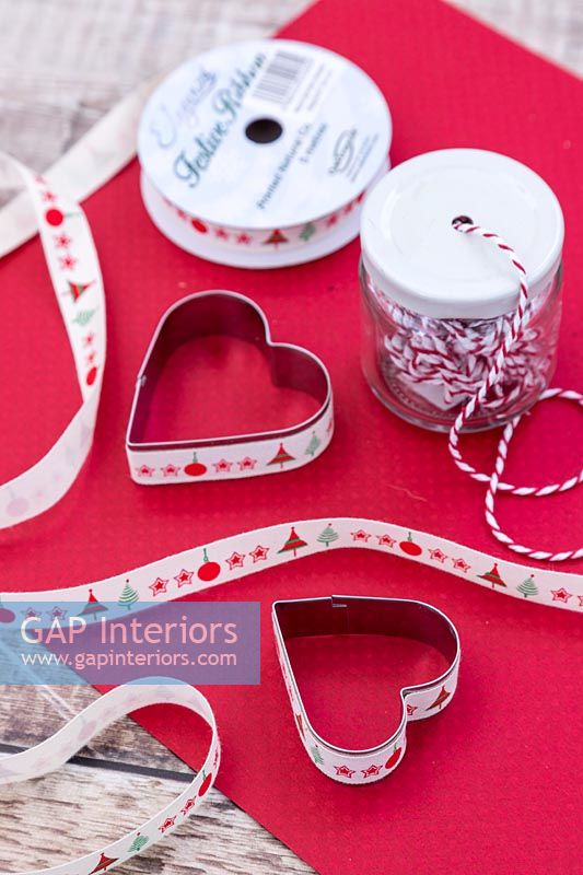 Metal cookie cutter covered with fabric ribbon on the outside edge