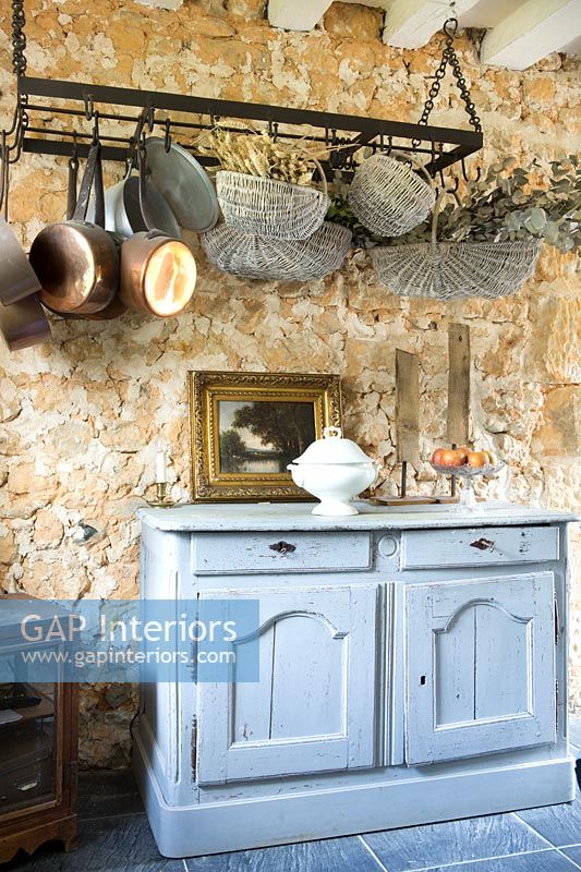 Exposed stone wall in country kitchen-diner 