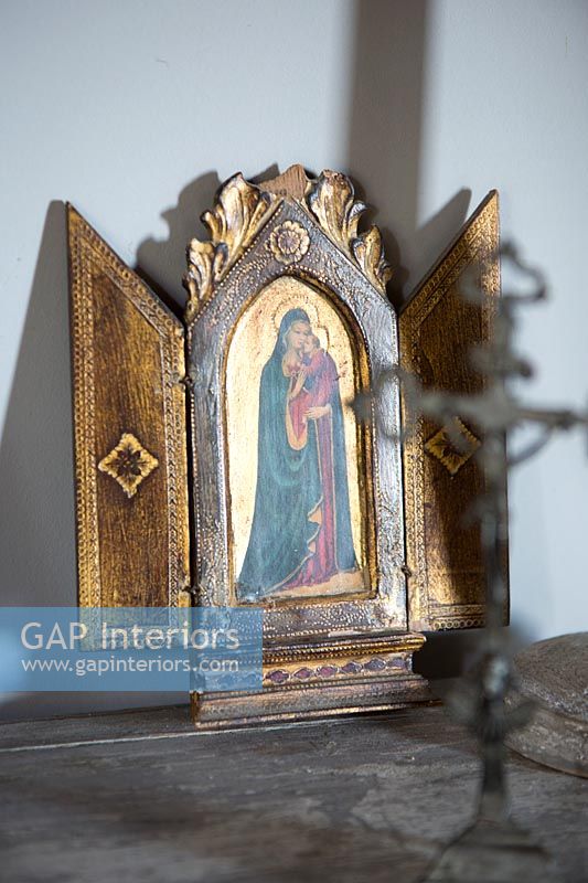Religious image in small ornate frame 