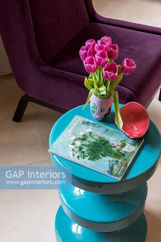 Detail of colourful modern turquoise side table 