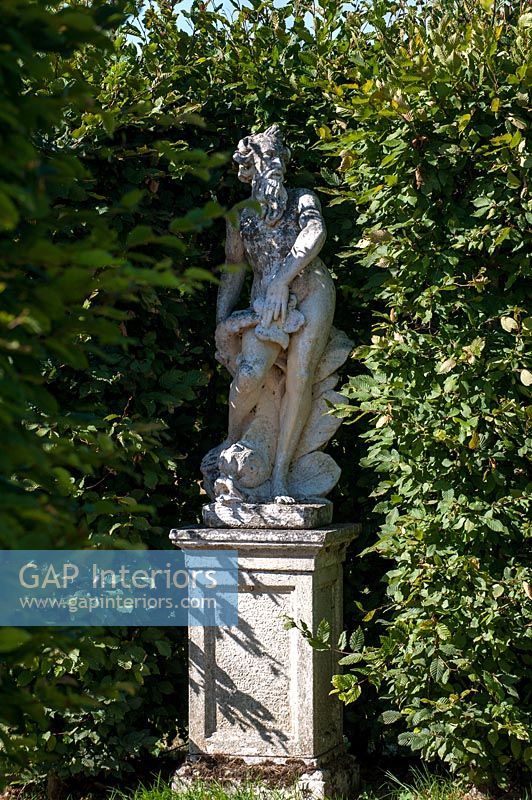 Classic statue in country garden 