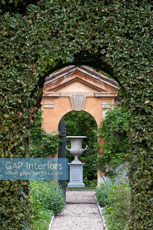 Large ornamental urn in formal garden 