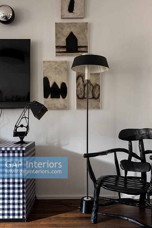Black, white and grey paintings and furniture 