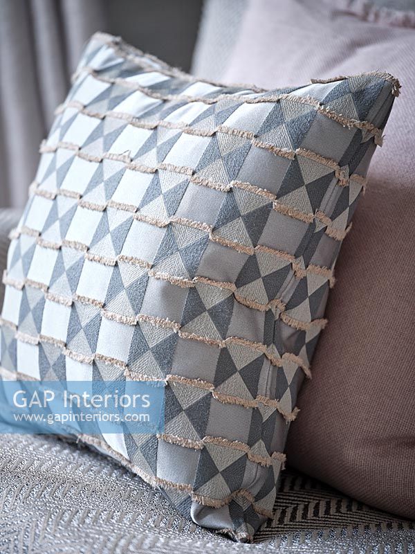 Grey patterned cushion detail 