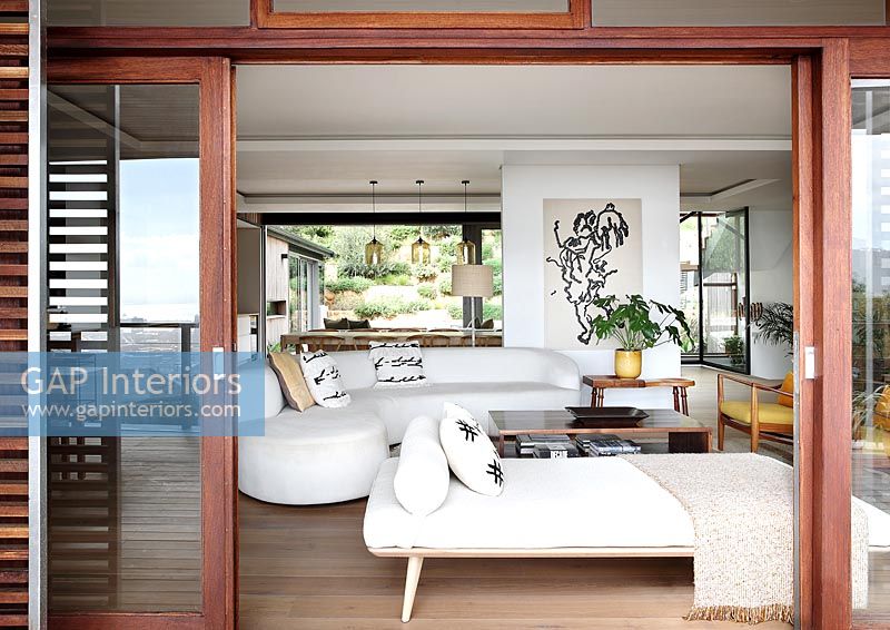 View through open patio doors into modern living room 