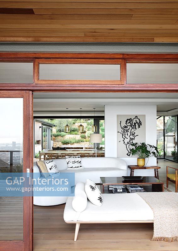 View through open patio doors into modern living room 