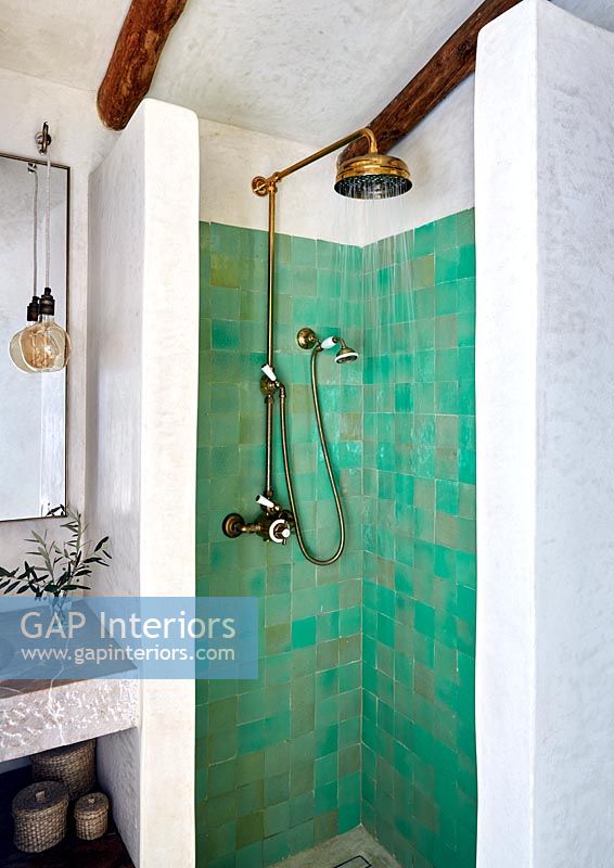 Green tiled shower in white country bathroom 