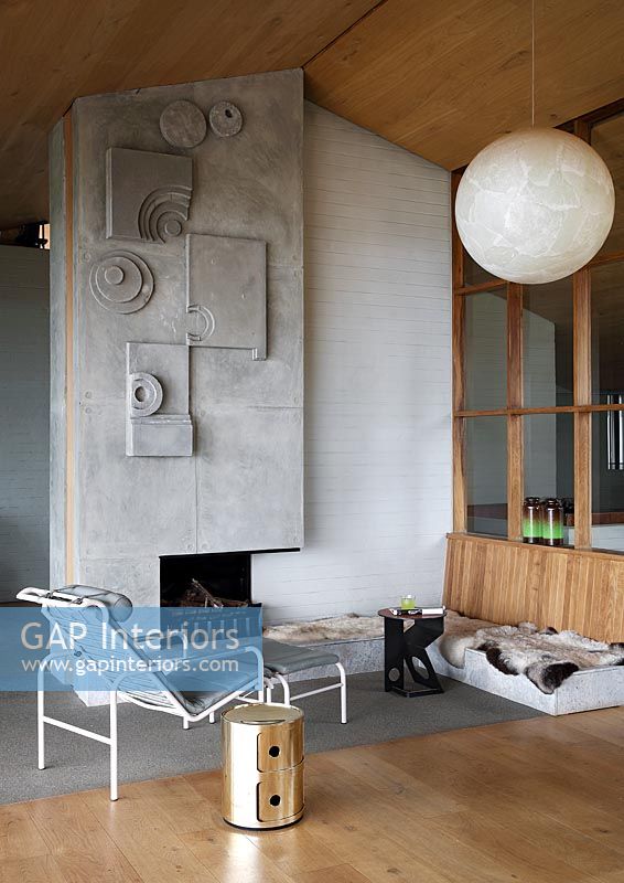 Contemporary living room with unusual textured concrete fireplace 