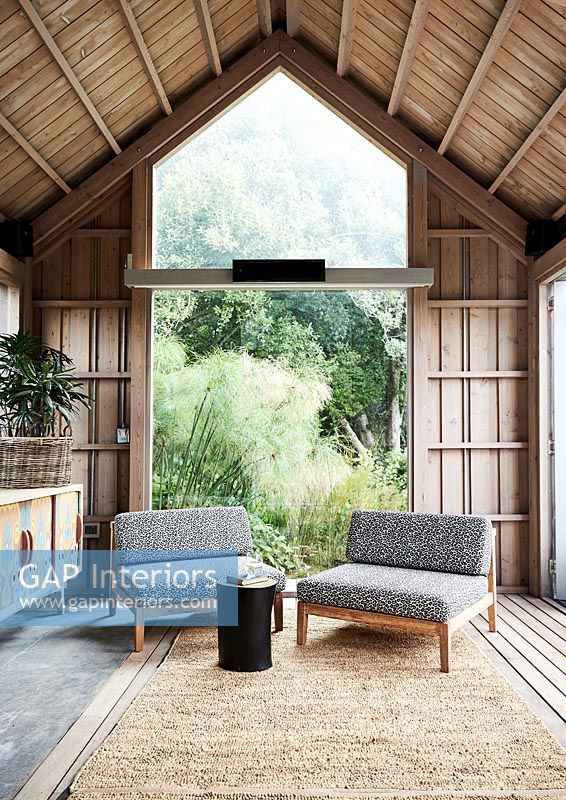 Modern living room in wooden cabin