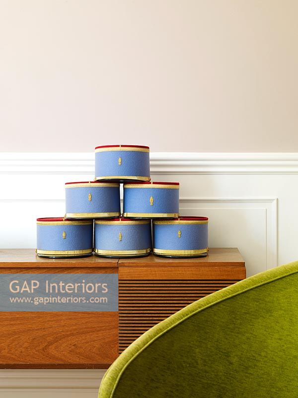 Collection of decorative hat boxes on sideboard 
