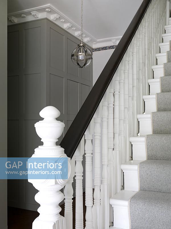 Classic style modern hallway with grey stair carpet 