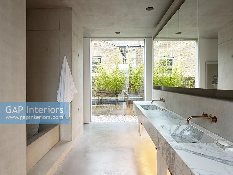 Contemporary concrete and marble bathroom 
