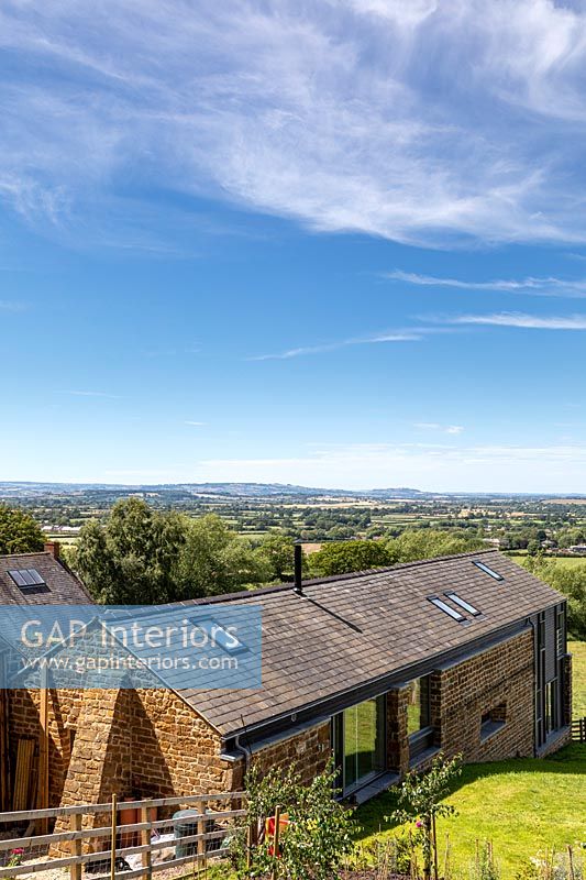 Exterior of country house with scenic countryside views beyond 