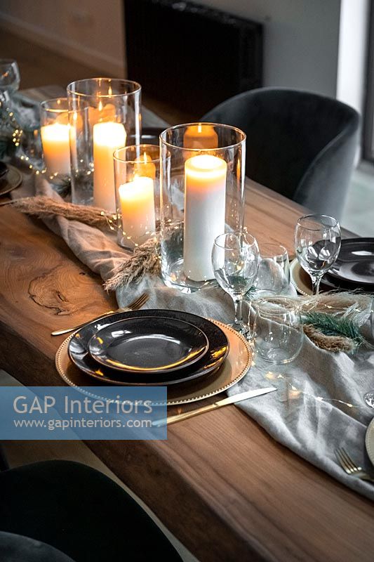 Candles on table runner - dining table at Christmas detail