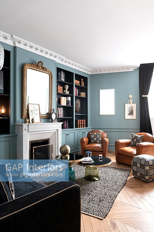 Classic style living room with blue painted walls 