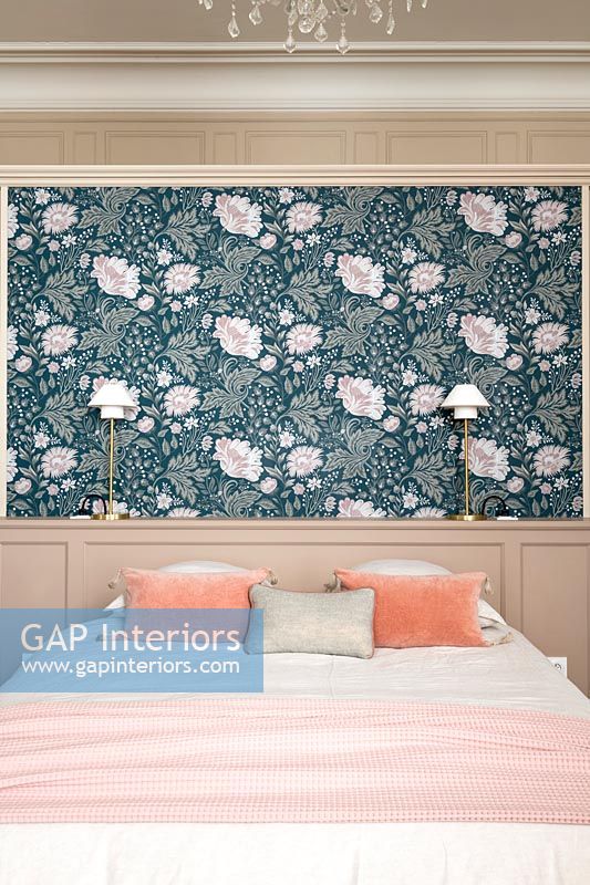 Floral wallpaper on feature wall behind bed 