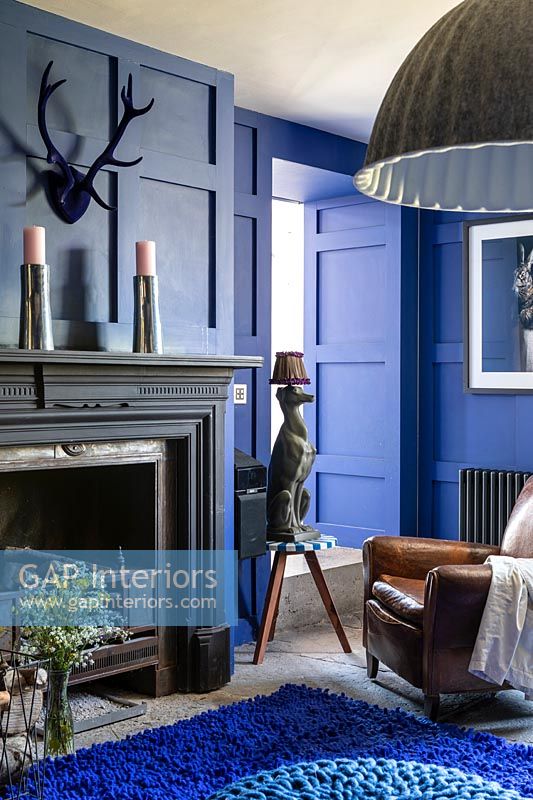 Blue painted panelled living room 