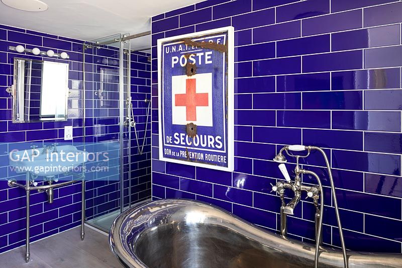Colourful blue tiling in modern bathroom 